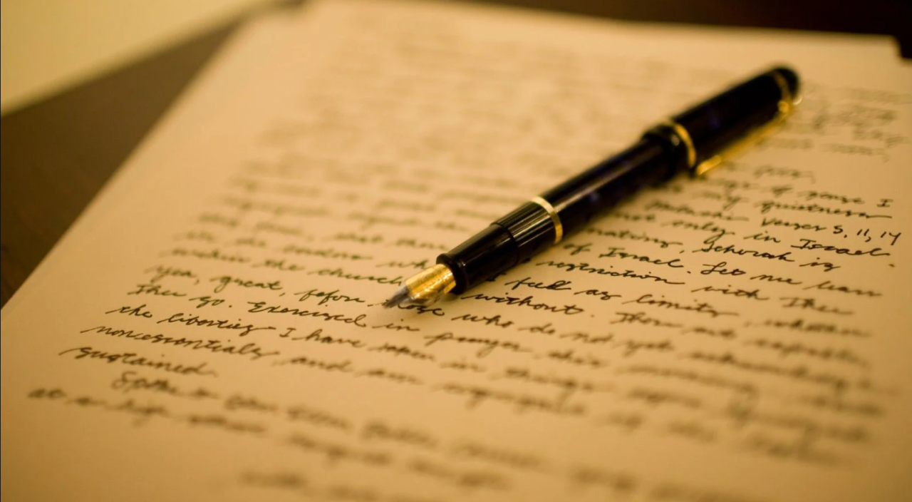 Notebook and pen representing writing self-assessment