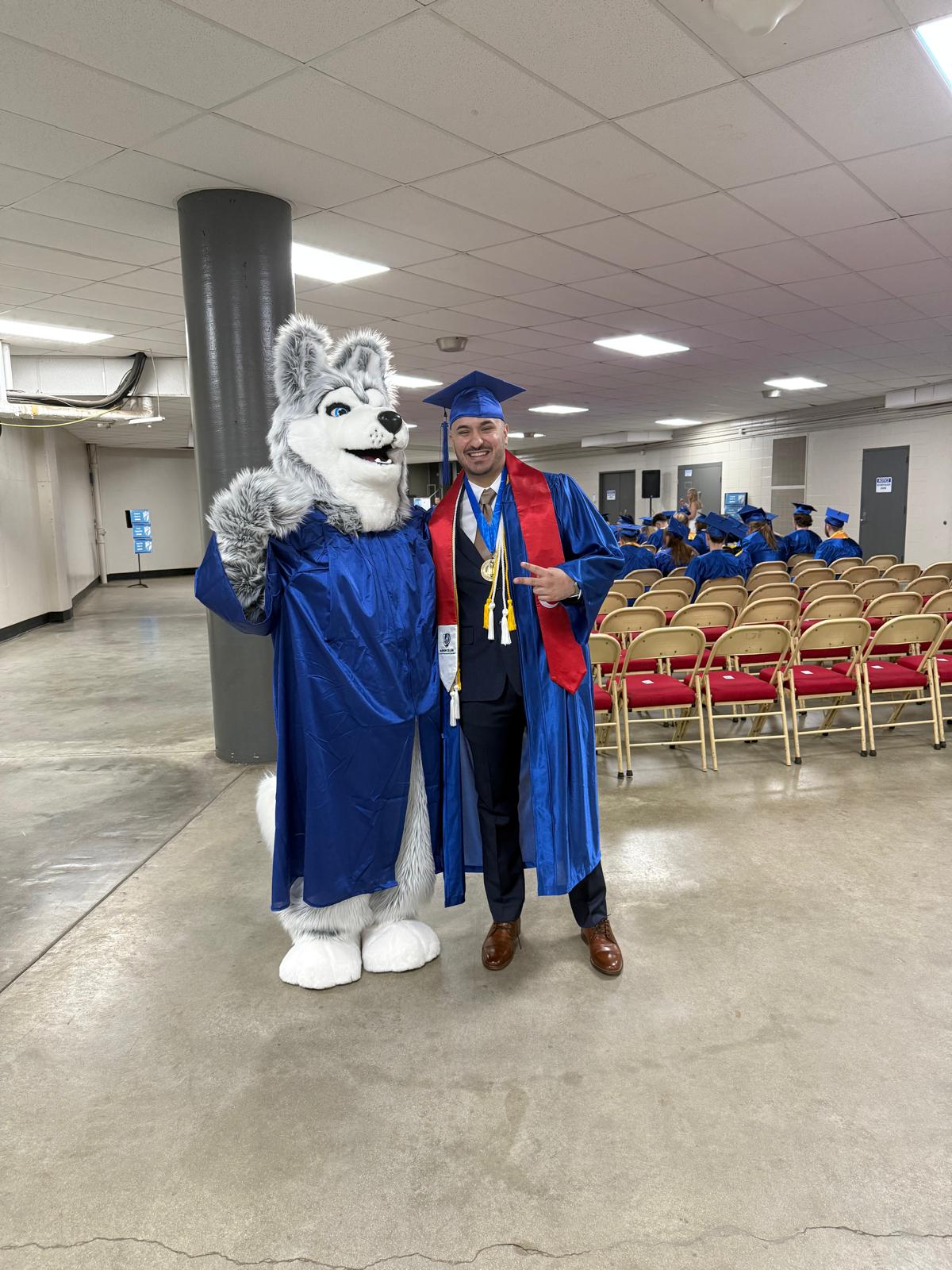 Photo with the mascot during graduation