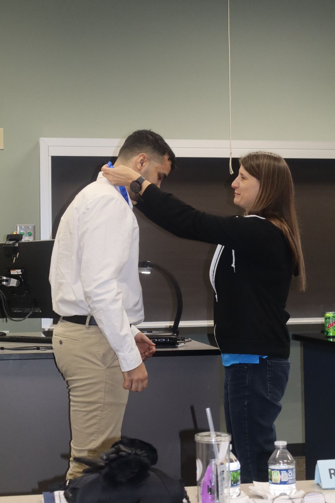 Placing the Honors Medallion on Furkan Sindar.