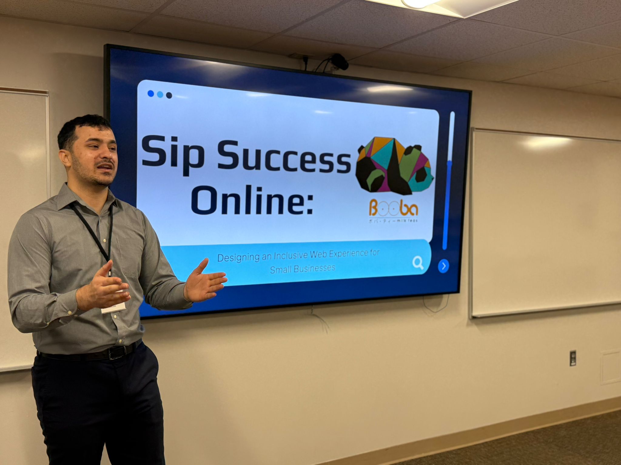 Standing in front of presentation screen