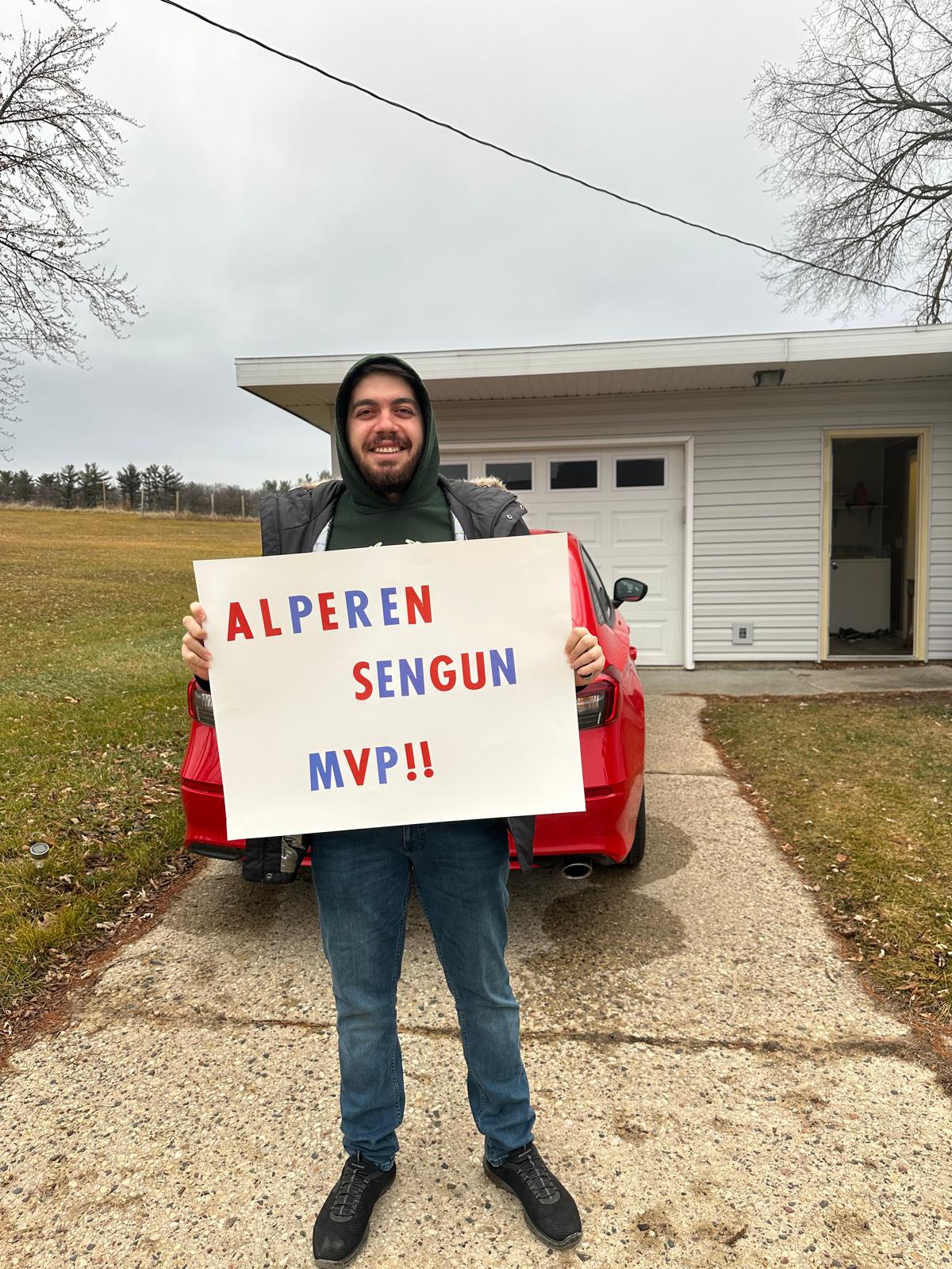 Holding sign before Bucks game