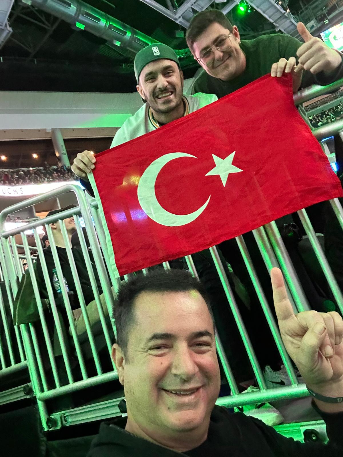 Holding Turkish flag at the game
