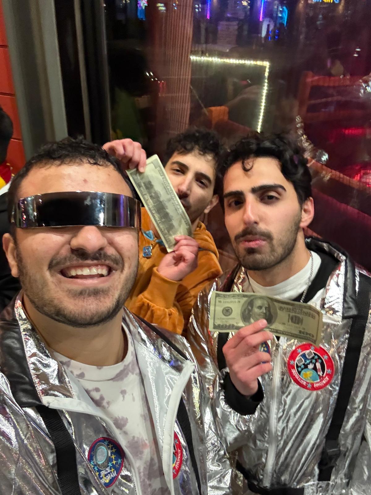 Halloween selfie with friends in astronaut costumes